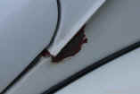 vw bug show photos red oxide off side gutter.JPG (85227 bytes)